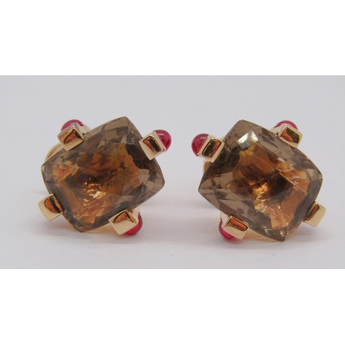 321 - Pair of 18ct stud earrings set with faceted hessonite and cabochon rubies, 20.5g