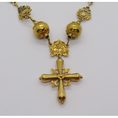 323 - Yellow metal cross pendant necklace with intricate filigree work, 36.5g