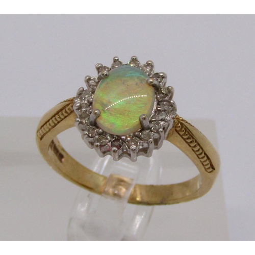 335 - 9ct opal and diamond oval cluster ring, size Q, 4.1g