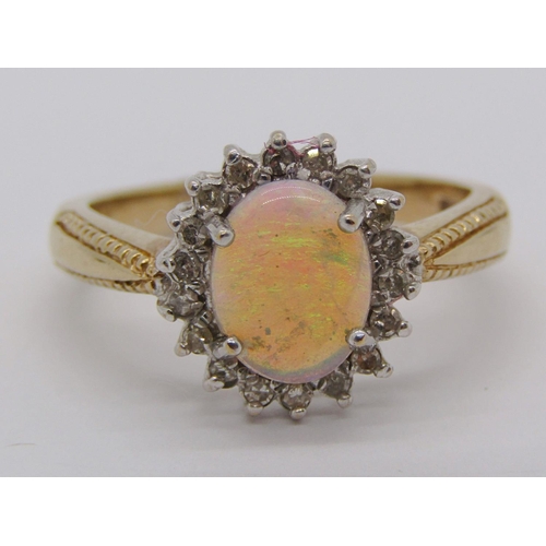 335 - 9ct opal and diamond oval cluster ring, size Q, 4.1g