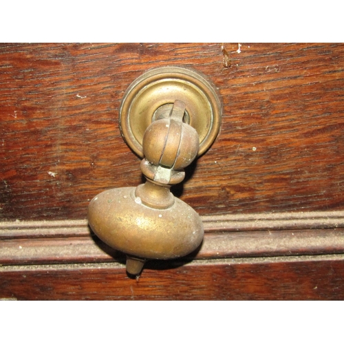 1257 - An antique old English style oak court cupboard enclosed by an arrangement of cupboards and drawers ... 