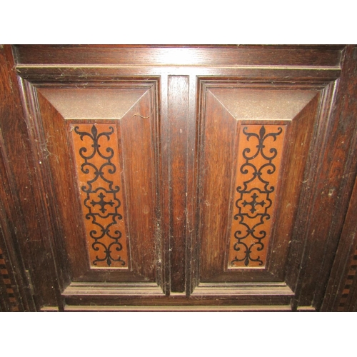 1257 - An antique old English style oak court cupboard enclosed by an arrangement of cupboards and drawers ... 