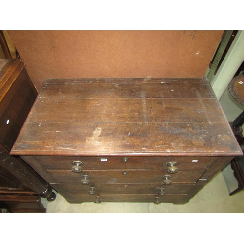 1262 - A Georgian oak two sectional bedroom chest of four long drawers flanked by moulded panelled sides an... 