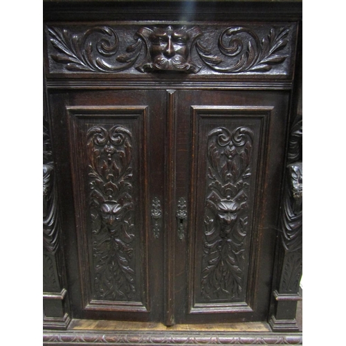 1270 - A good substantial Victorian Gothic oak hallstand of full height, the carved framework interspersed ... 