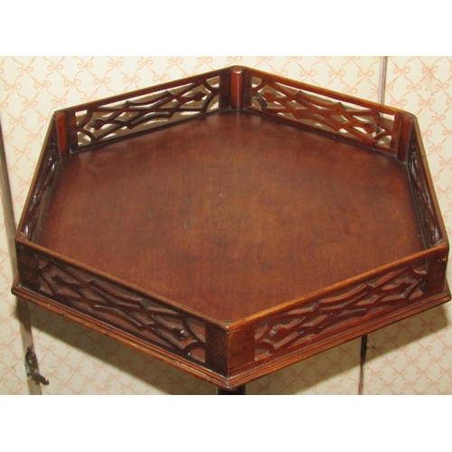 1273 - A mahogany occasional table in the Chippendale manner, the hexagonal top with pierced fretwork galle... 