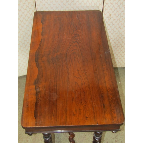 1279 - A Victorian rosewood centre table of rectangular form with rounded corners raised on spiral twist co... 