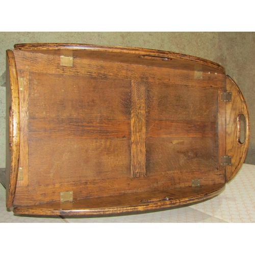 1282 - A reproduction oak butlers tray in the Georgian style, of rectangular form with brass hinged drop le... 