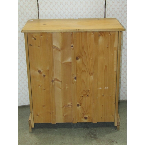 1305 - A small stripped pine side cupboard, freestanding and enclosed by a pair of rectangular moulded pane... 