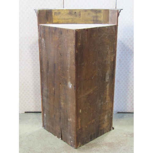 1311 - A Georgian style mahogany hanging corner cabinet enclosed by an astragal glazed panelled door, revea... 