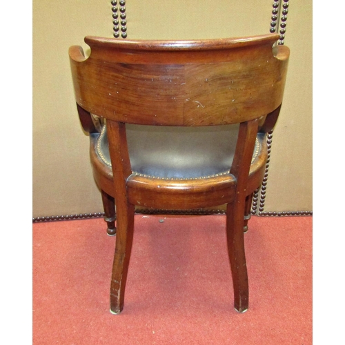 1511 - A mid-19th century mahogany office or library chair, the horseshoe shaped back raised on swept suppo... 