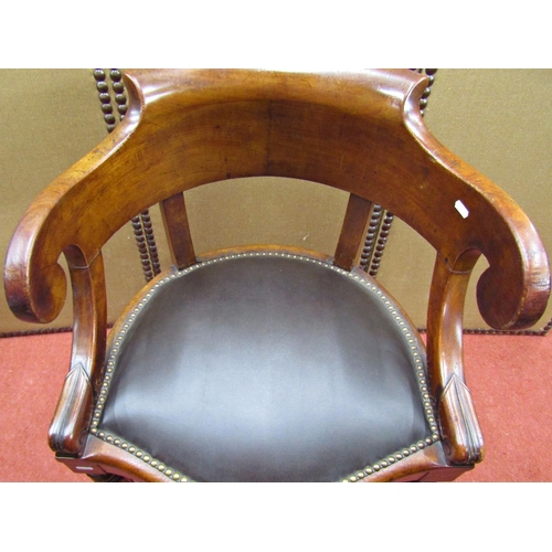 1511 - A mid-19th century mahogany office or library chair, the horseshoe shaped back raised on swept suppo... 