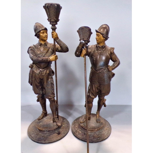 703 - A pair of painted spelter figures of soldiers holding braziers. (As found)