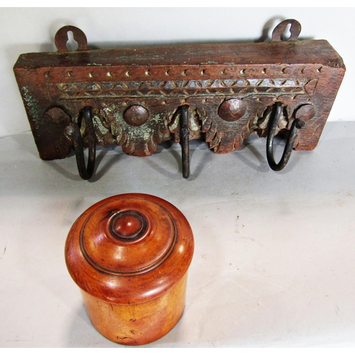 785 - A 19th century walnut turned canister with a screw top and a portion of coat hooks on a carved woode... 