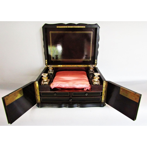 787 - A Victorian ladies travelling toiletry/ jewellery box with four gilded perfume bottles arranged arou... 