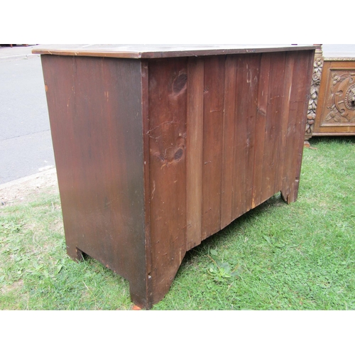 1324 - An Edwardian oak arts and crafts style dressing chest of three long graduated drawers, with anodised... 