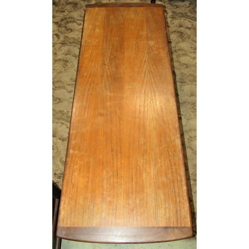 1326 - A mid-20th century long and low teak occasional table of rectangular form with cleated and slightly ... 