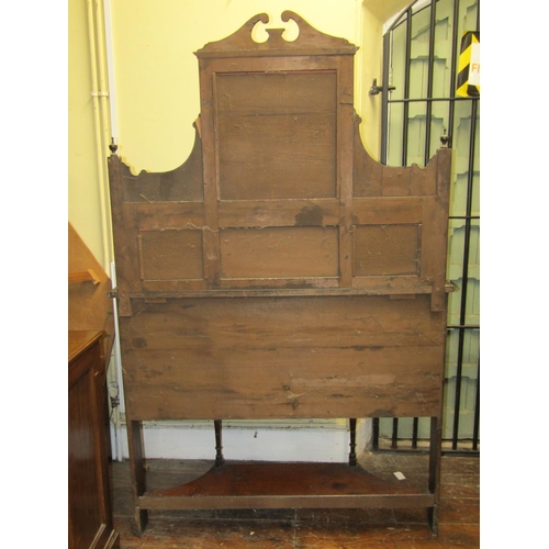 1519 - A Victorian mahogany chiffonier, the base enclosed by a central cupboard flanked by open shelves, wi... 