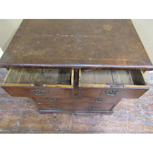 1555 - A small Georgian countrymade chest of three long and two short drawers, with burr elm veneers, cross... 