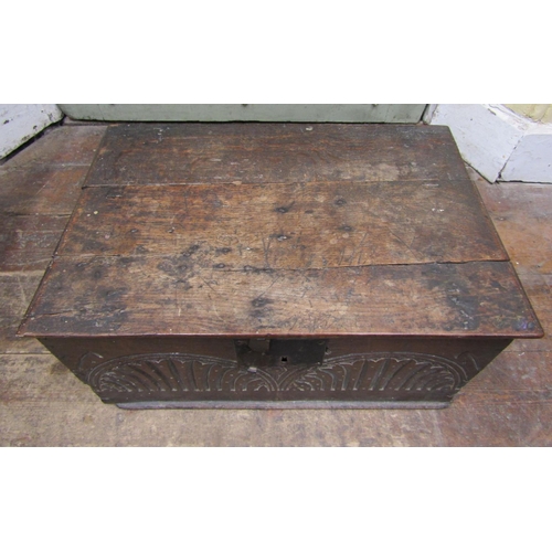 1560 - An 18th century oak bible box with rising lid the front elevation with repeating lunette carved deta... 