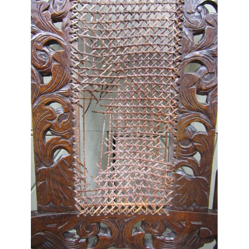 1561 - A Carolean walnut elbow chair with carved and pierced detail, scrolled arms, barley twist and other ... 