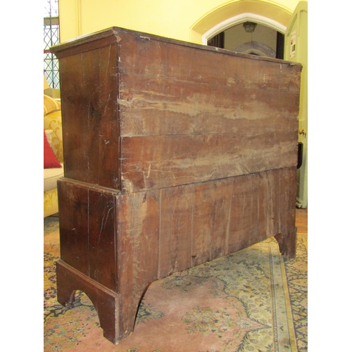 1563 - An 18th century Welsh oak linen chest with rising lid over four arched and fielded panels, the lower... 