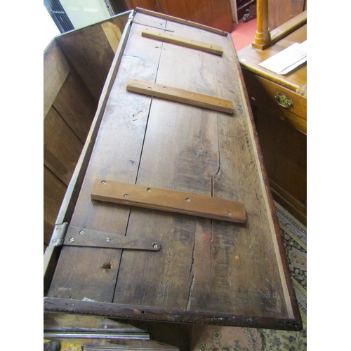 1563 - An 18th century Welsh oak linen chest with rising lid over four arched and fielded panels, the lower... 