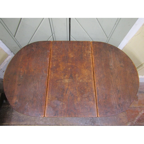 1607 - A small old English oak drop leaf occasional table on turned supports, 53cm long x 50cm high