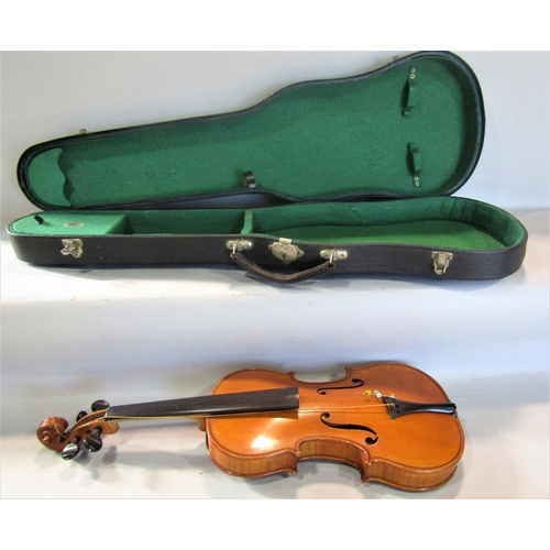 807 - A small violin, in need of restoration, bearing no interior label with a single bow and case, 55cm x... 