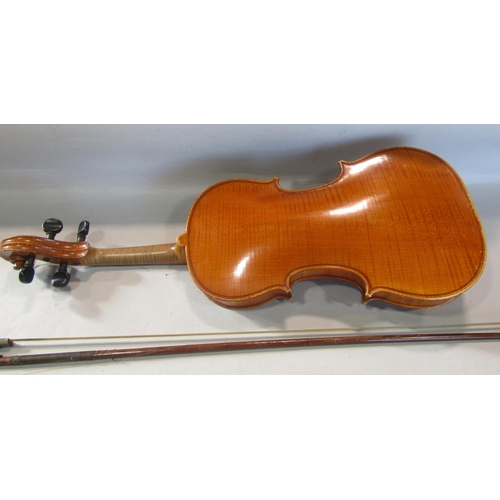 807 - A small violin, in need of restoration, bearing no interior label with a single bow and case, 55cm x... 