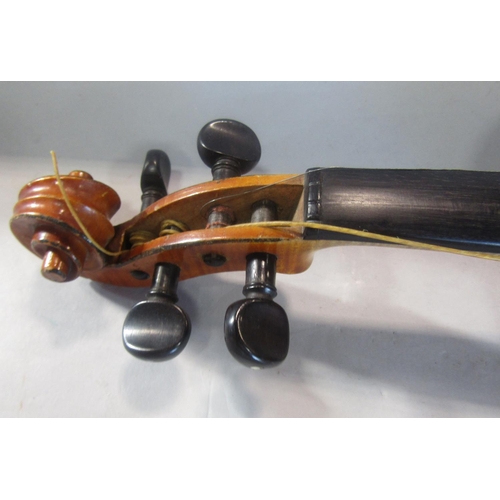 807 - A small violin, in need of restoration, bearing no interior label with a single bow and case, 55cm x... 