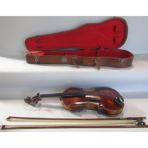 808 - A violin, in need of restoration, with a distressed unreadable label to the interior with a Tourte M... 