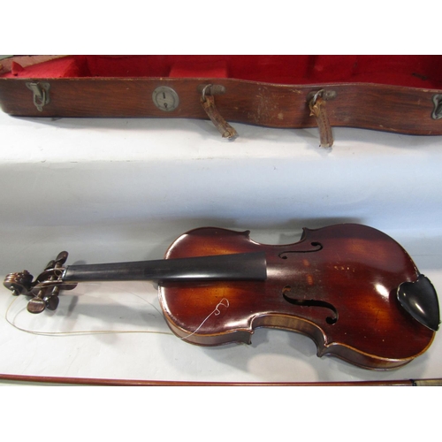 808 - A violin, in need of restoration, with a distressed unreadable label to the interior with a Tourte M... 