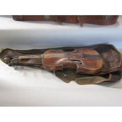 808 - A violin, in need of restoration, with a distressed unreadable label to the interior with a Tourte M... 