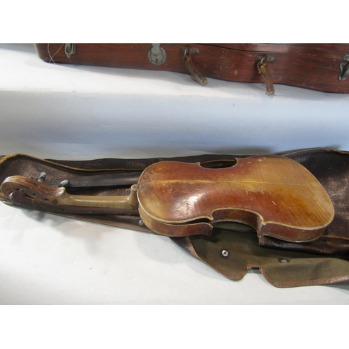 808 - A violin, in need of restoration, with a distressed unreadable label to the interior with a Tourte M... 