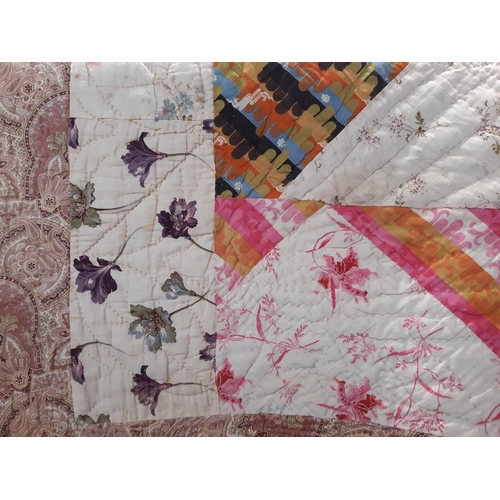 601 - Vintage reversibile quilt with large sections of printed cottons stitched together and quilted in ru... 