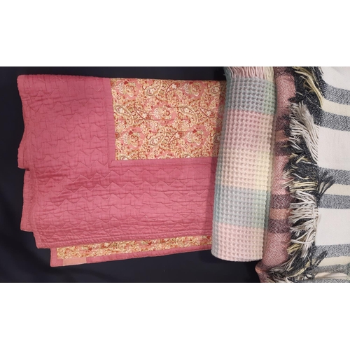 604 - Vintage reversible machine stitched quilt, with blocks of pink contrasted with multicoloured paisley... 