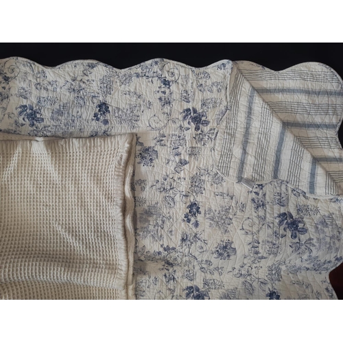 609 - Machine made reversible quilt with toile de jouy type print on one side and contrasting stripe verso... 