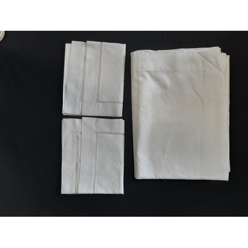 616 - Bed and table linen including a sheet (width 180cm) and 2 matching pillow cases in white cotton with... 