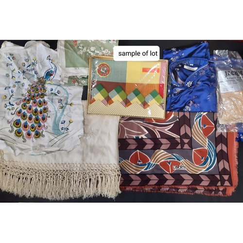 617 - Mixed box of textiles including a woollen Liberty scarf, a fringed silk shawl, an embroidered panel ... 