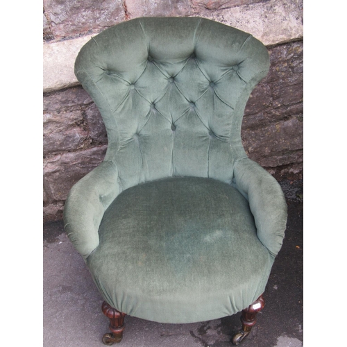 1343 - A Victorian low nursing or drawing room chair with shaped outline, buttoned green upholstery and rai... 