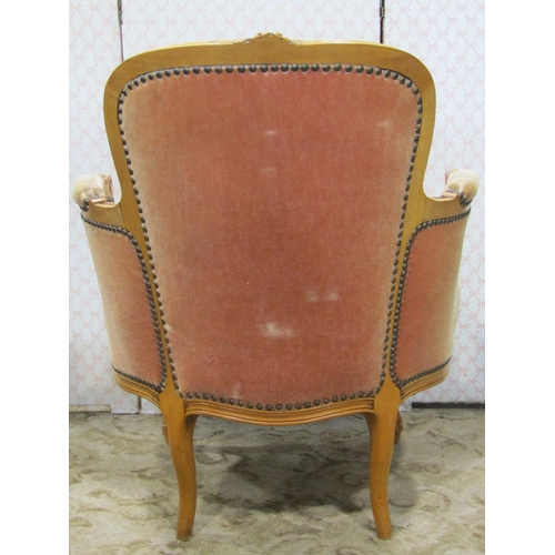 1346 - A salon chair with shaped carved and moulded beechwood frame enclosing an upholstered seat and back ... 