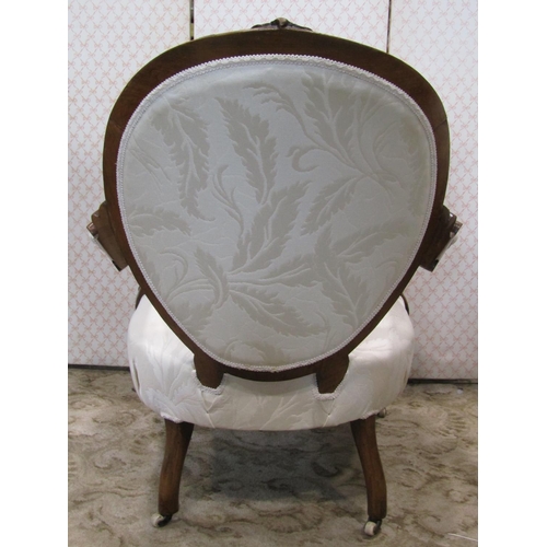 1353 - A Victorian drawing room chair with cream ground repeating leaf patterned upholstered seat with serp... 