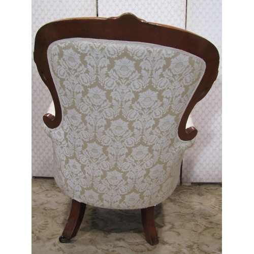 1354 - A Victorian drawing room chair with cream ground repeating floral patterned upholstered seat back an... 