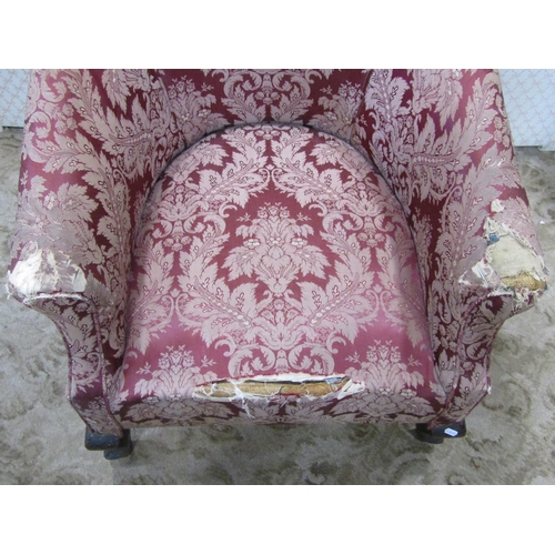 1370 - An Edwardian tub chair with swept and rolled arms, upholstered finish raised on shaped cabriole fore... 