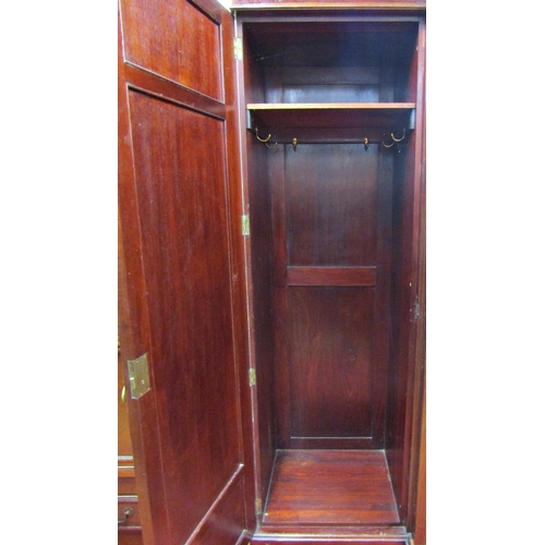 1576 - A good quality Edwardian mahogany breakfront wardrobe enclosed by a central mirror panelled door wit... 