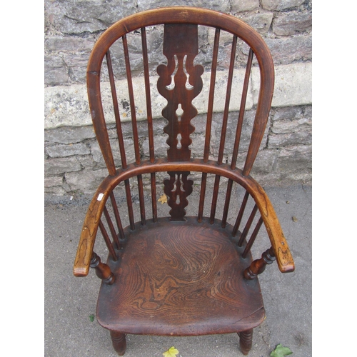 1601a - A Georgian hoop back elbow chair in elm and ash wood with crinoline stretcher