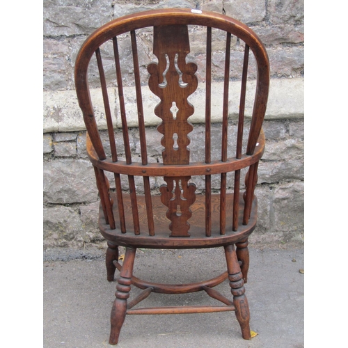 1601a - A Georgian hoop back elbow chair in elm and ash wood with crinoline stretcher