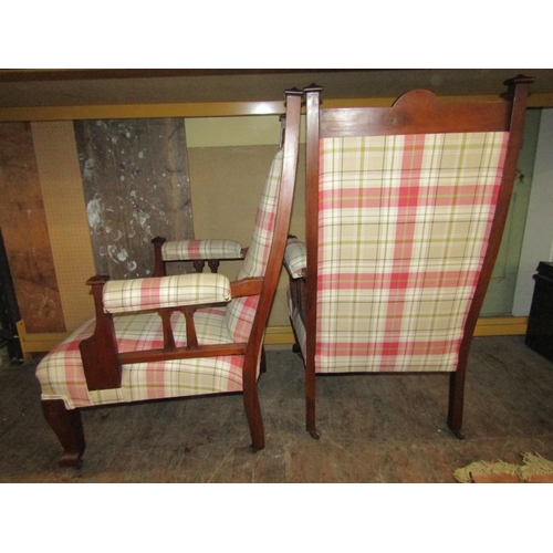 1635 - A pair of arts and crafts fireside chairs in walnut with recently reupholstered finish