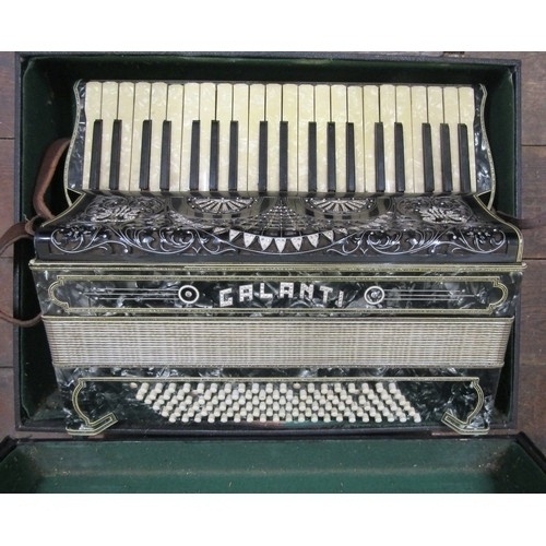 832 - A vintage  Galanti piano accordion with pearlised and diamanté body and keys, with it’s case.