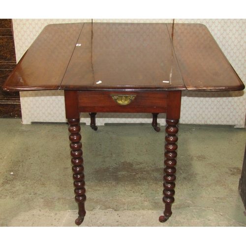 1365 - A Victorian mahogany Pembroke table fitted with a frieze drawer raised on turned bobbin legs with br... 